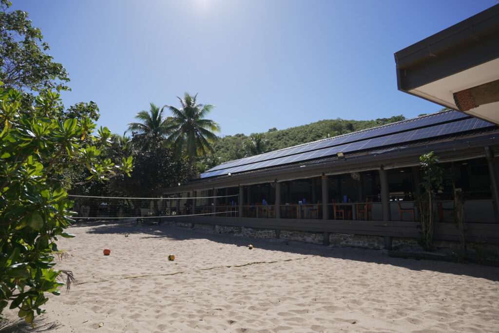Solar panels and palm trees at Yasawa Islands resort, Fiji